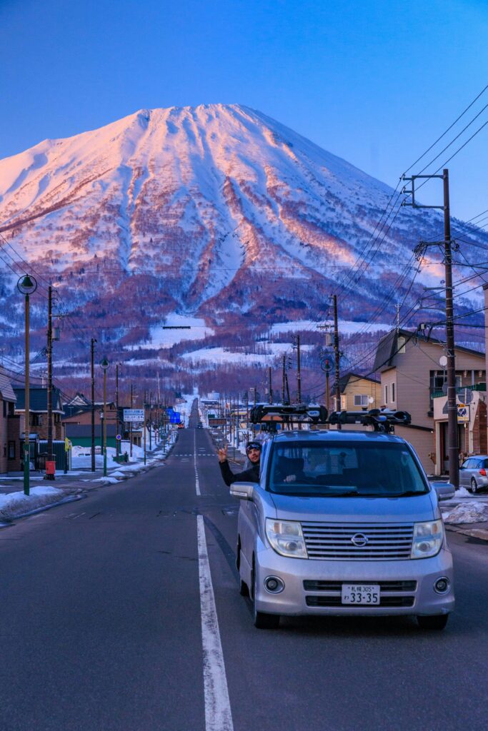 pexels-photo-31112561-31112561 A scenic drive through Niseko with Mount Yotei in the background during winter.